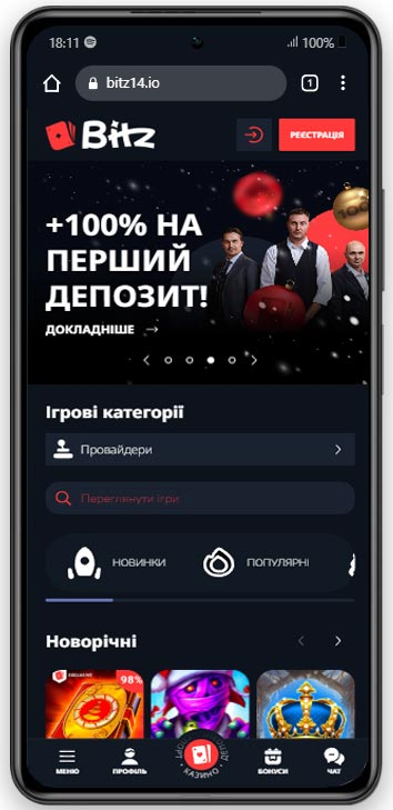 Мобільний інтерфейс казино Bitz із банером про вітальний бонус 100% на перший депозит та доступом до ігрових категорій.